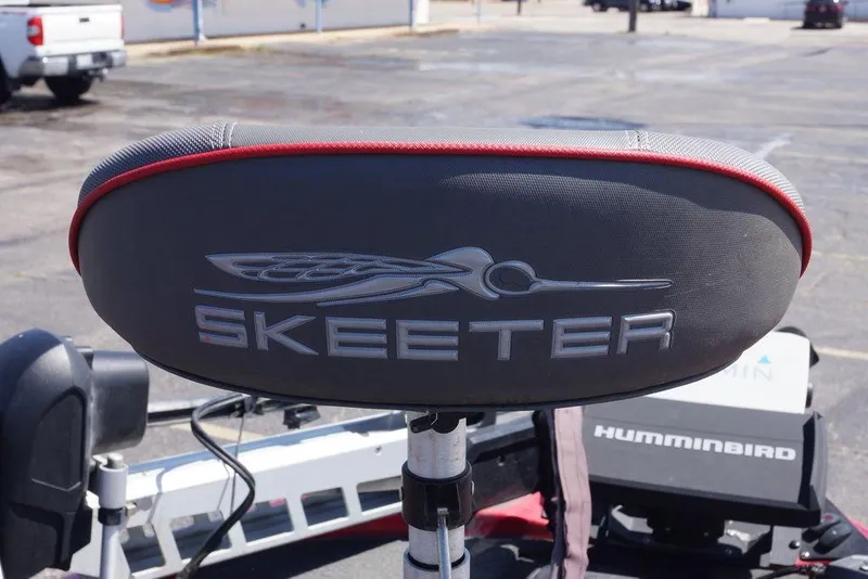 Slide: The Image of 2019 Skeeter ZX250 boat seat with logo, featuring Humminbird equipment in the background. - 17
