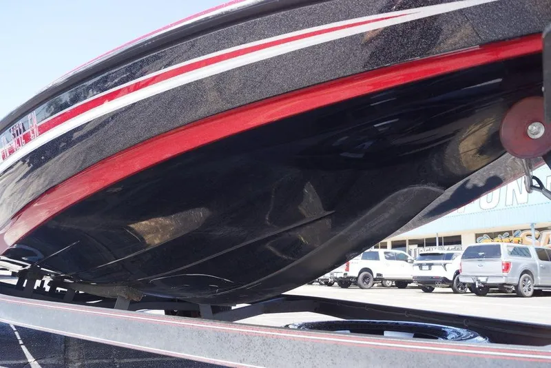 Slide: The Image of 2019 Skeeter ZX250 boat hull on trailer, showcasing sleek design and vibrant colors. - 19