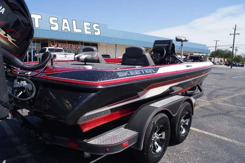Slide: The Image of 2019 Skeeter ZX250 boat parked outside a sales building on a sunny day. - 22