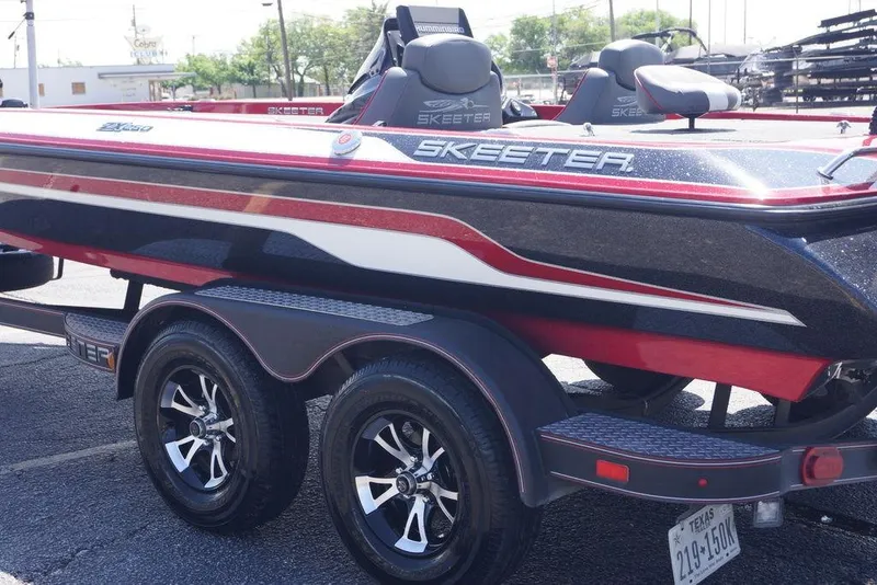 Slide: The Image of 2019 Skeeter ZX250 boat on trailer, featuring sleek design and vibrant colors. - 24