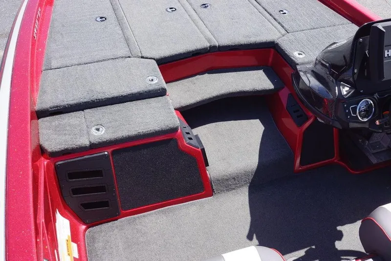 Slide: The Image of 2019 Skeeter ZX250 boat interior with red accents and carpeted deck. - 3