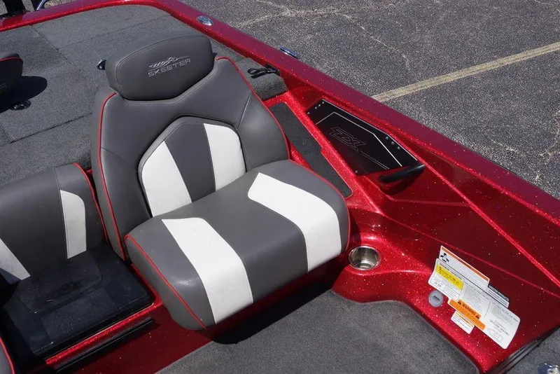 Slide: The Image of 2019 Skeeter ZX250 boat seat with red metallic finish and gray-white upholstery. - 4
