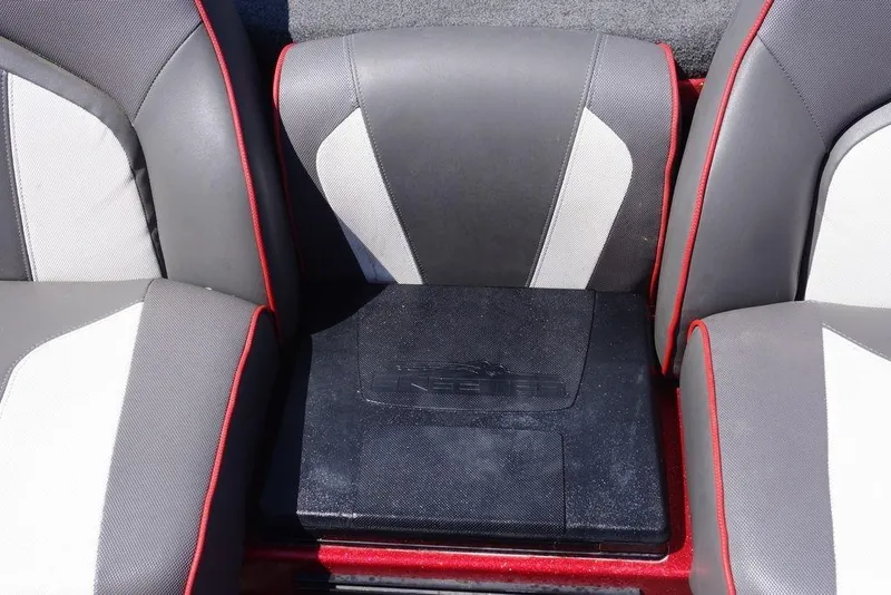 Slide: The Image of 2019 Skeeter ZX250 boat seats with red accents and center storage compartment. - 5