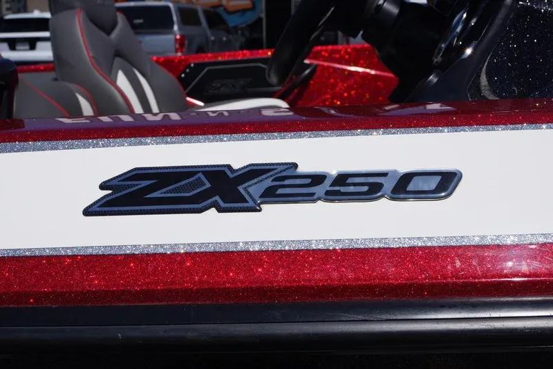 Slide: The Image of 2019 Skeeter ZX250 boat with glittery red and white detailing. - 8