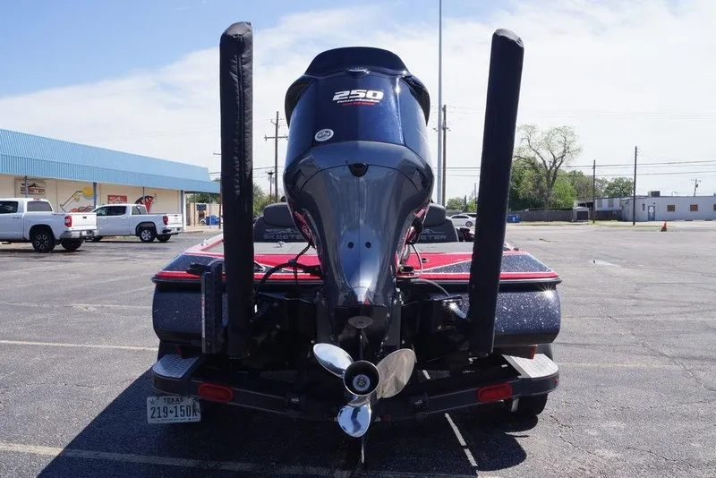 Slide: The Image of 2019 Skeeter ZX250 boat with powerful engine, parked in a lot, rear view. - 9