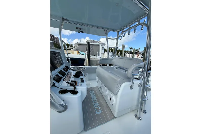 Slide: The Image of 2024 Contender 39 ST boat interior with helm, seating, and controls. - 21