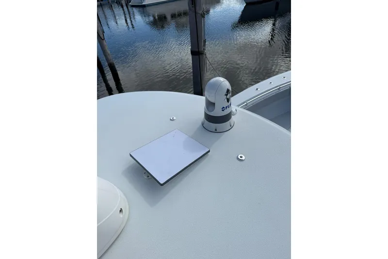 Slide: The Image of 2024 Contender 39 ST boat deck with FLIR camera and reflective panel. - 27