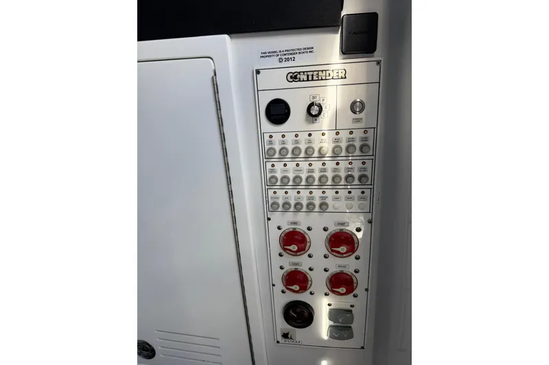 Slide: The Image of Control panel of 2024 Contender 39 ST boat, featuring switches and dials. - 37