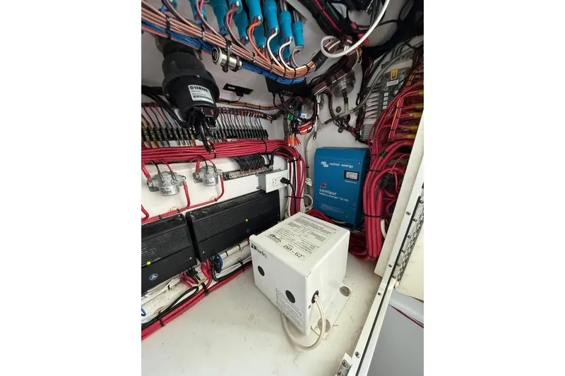 Slide: The Image of Electrical system of a 2024 Contender 39 ST boat, showcasing wiring and components. - 39