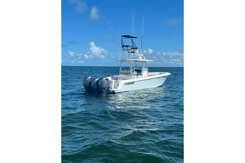 Slide: The Image of 2024 Contender 39 ST boat on open ocean with clear blue sky. - 4