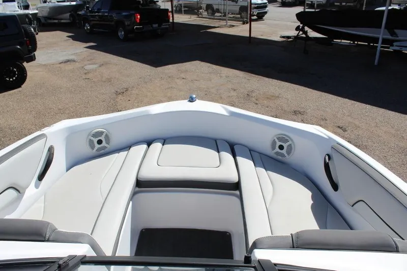 Slide: The Image of 2019 Skeeter SX190 boat interior with cushioned seating and speakers. - 11