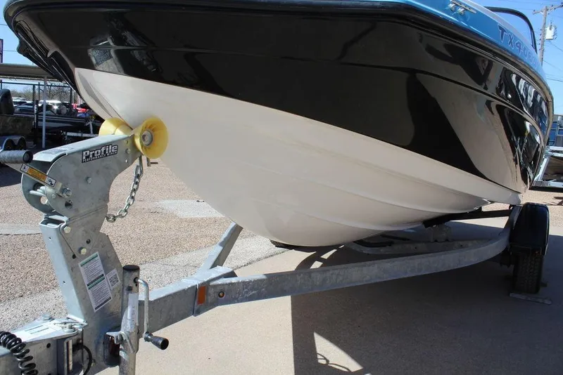 Slide: The Image of 2019 Skeeter SX190 boat on trailer, close-up view of hull and hitch. - 12