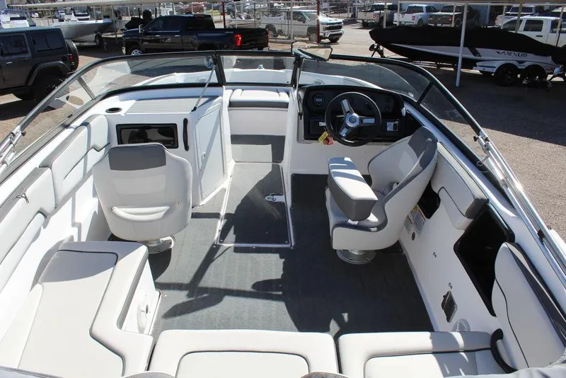 Slide: The Image of 2019 Skeeter SX190 boat interior with seating and steering console. - 13