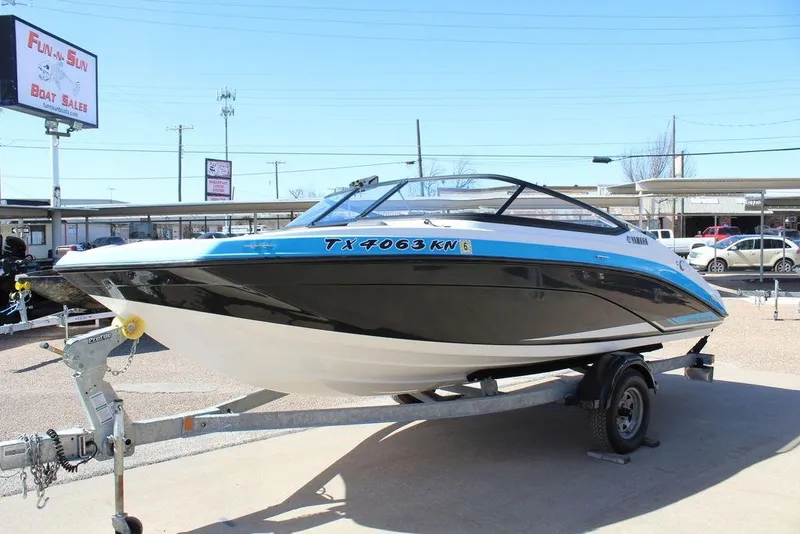 Slide: The Image of 2019 Skeeter SX190 boat on trailer at dealership, sunny day. - 5