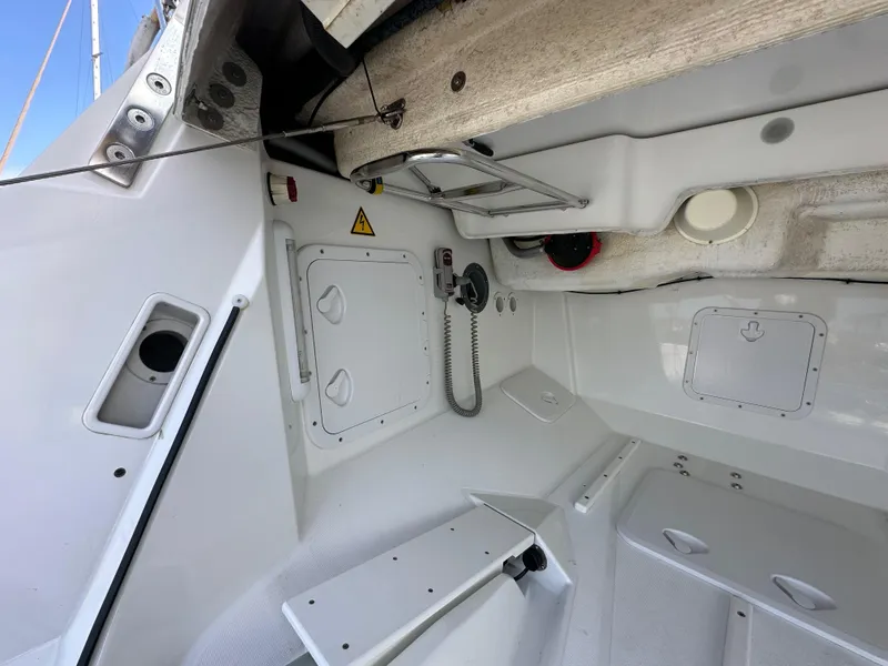 Slide: The Image of Interior view of a 2014 Jeanneau 57 sailboat, showcasing storage compartments and equipment. - 15