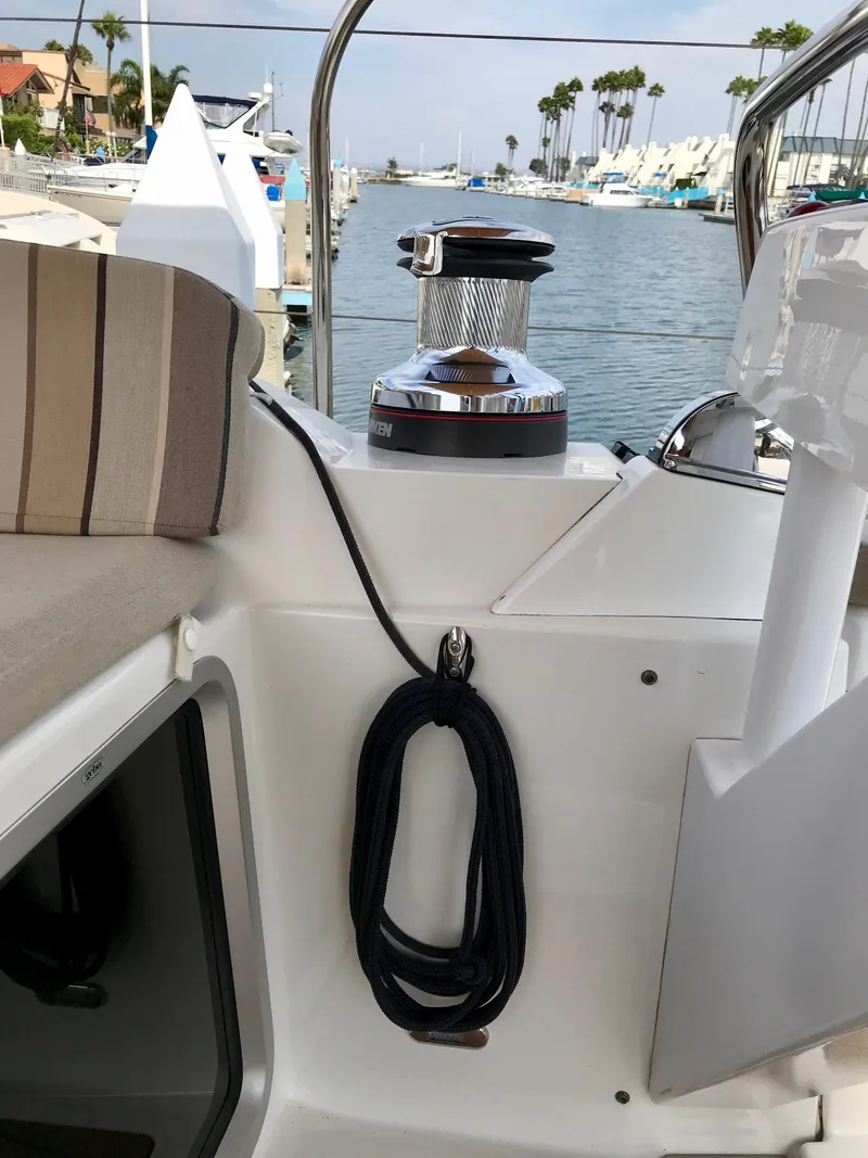 Slide: The Image of Jeanneau 57 sailboat deck view with winch and coiled rope, 2014 model. - 30
