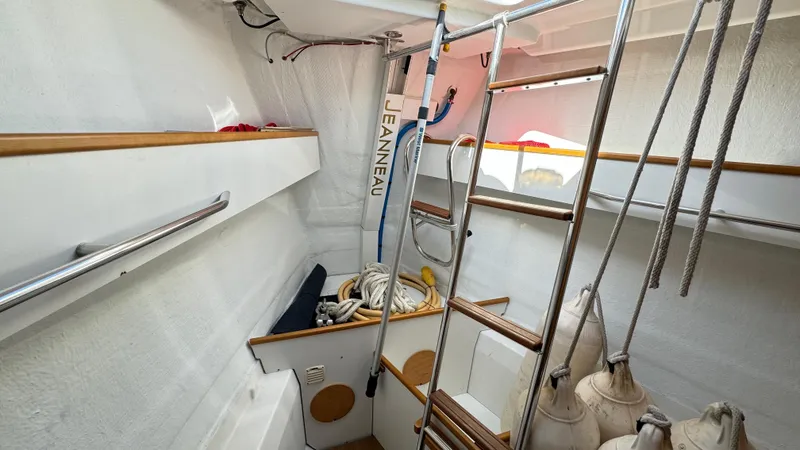 Slide: The Image of Interior of 2014 Jeanneau 57 sailboat with storage and ladder. - 46