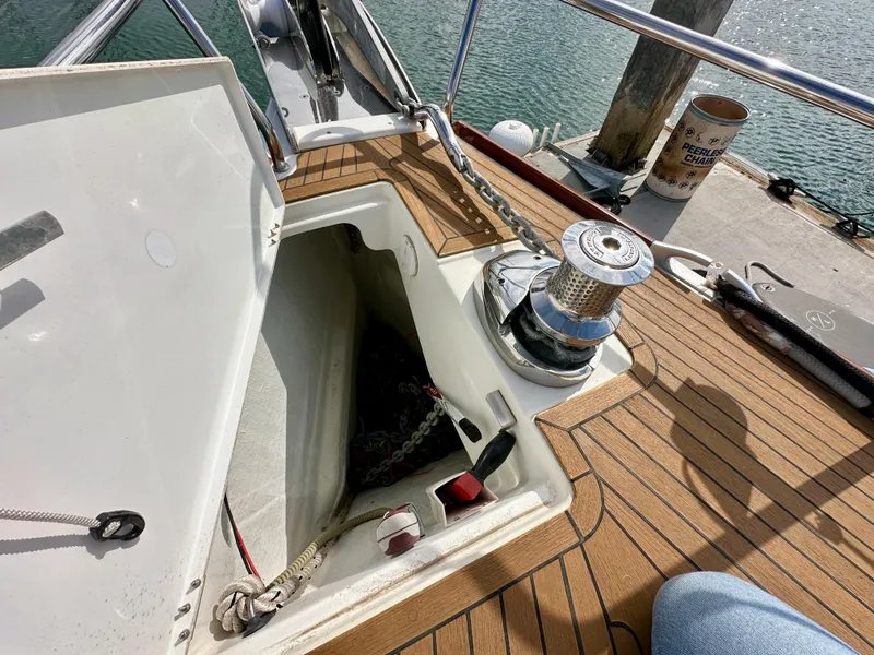Slide: The Image of Anchor locker and winch on 2014 Jeanneau 57 yacht deck. - 48