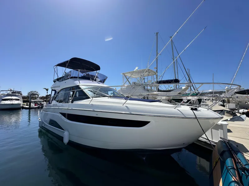 Slide: The Image of 2024 Bavaria R40 yacht docked at marina under clear blue sky. - 31