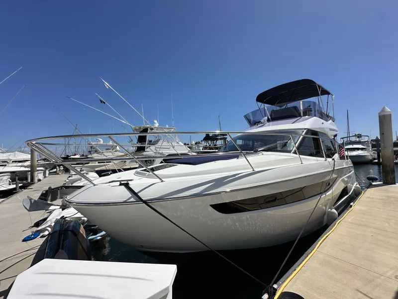 Slide: The Image of 2024 Bavaria R40 yacht docked at marina under clear blue sky. - 33