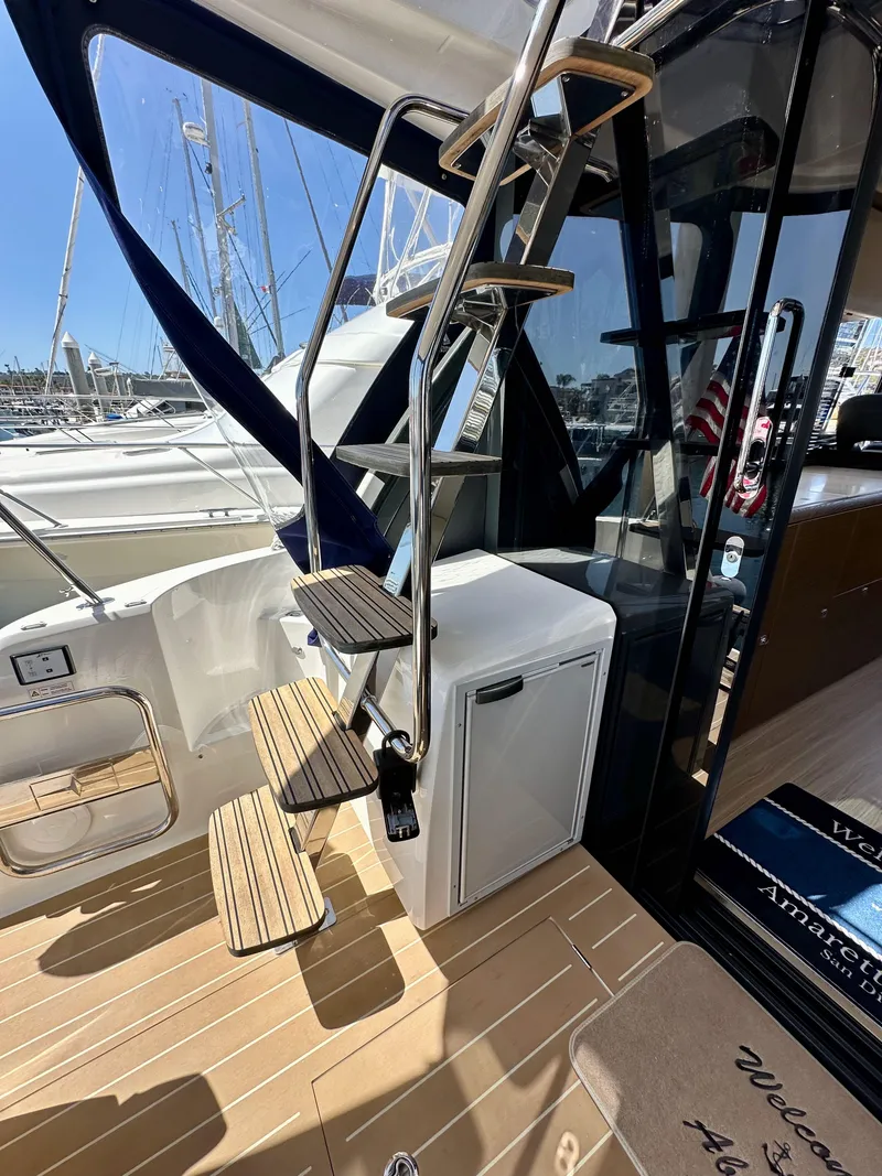 Slide: The Image of 2024 Bavaria R40 yacht with elegant wooden steps and modern design. - 43