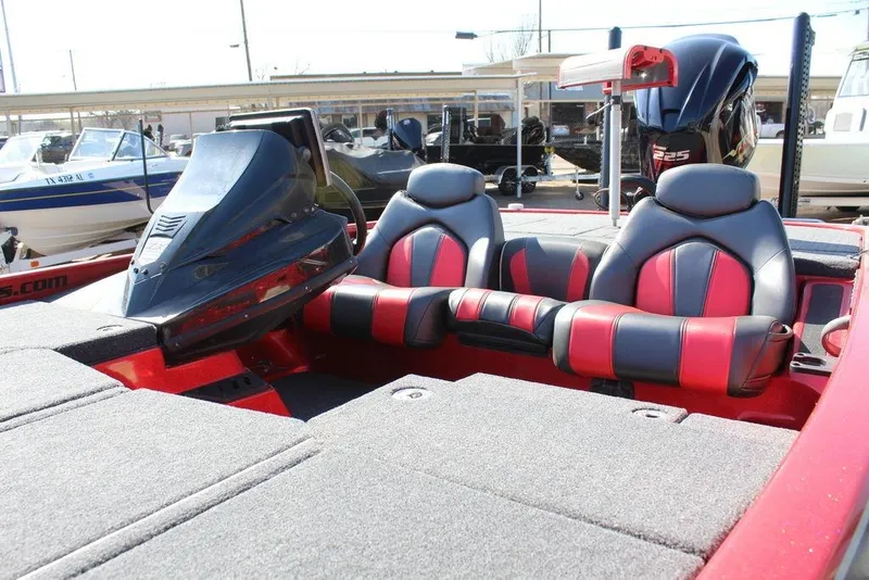 Slide: The Image of 2018 Skeeter ZX225 bass boat interior with dual seats and console, showcasing sleek design. - 5