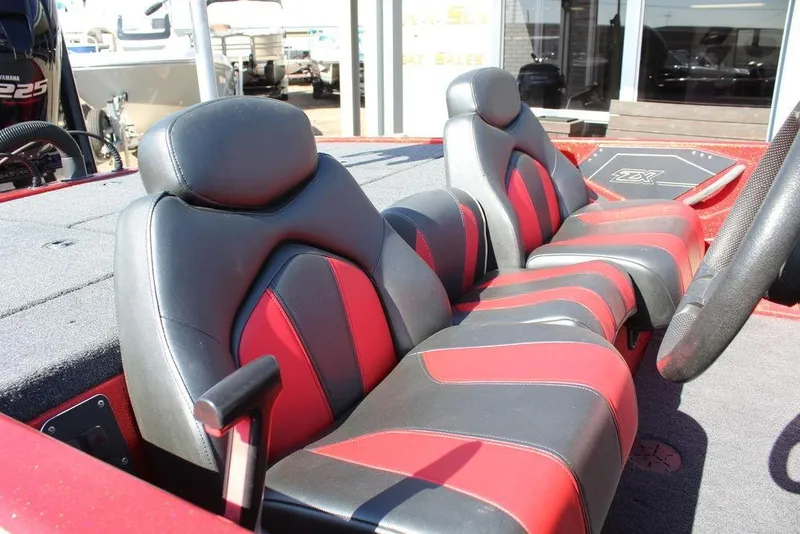 Slide: The Image of 2018 Skeeter ZX225 boat interior with red and black seating, showcasing sleek design. - 6