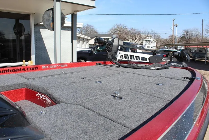 Slide: The Image of 2018 Skeeter ZX225 boat deck with trolling motor, parked outdoors. - 7