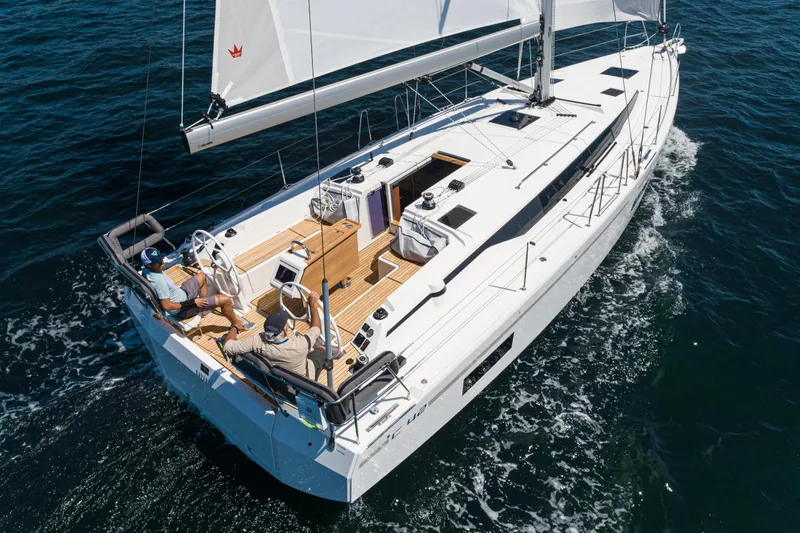 Slide: The Image of 2023 Bavaria C42 yacht sailing on open water, featuring sleek design and spacious deck. - 20