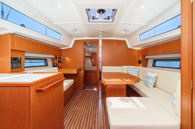 Slide: The Image of Luxurious interior of 2023 Bavaria C42 yacht with modern wood finish and spacious seating. - 32