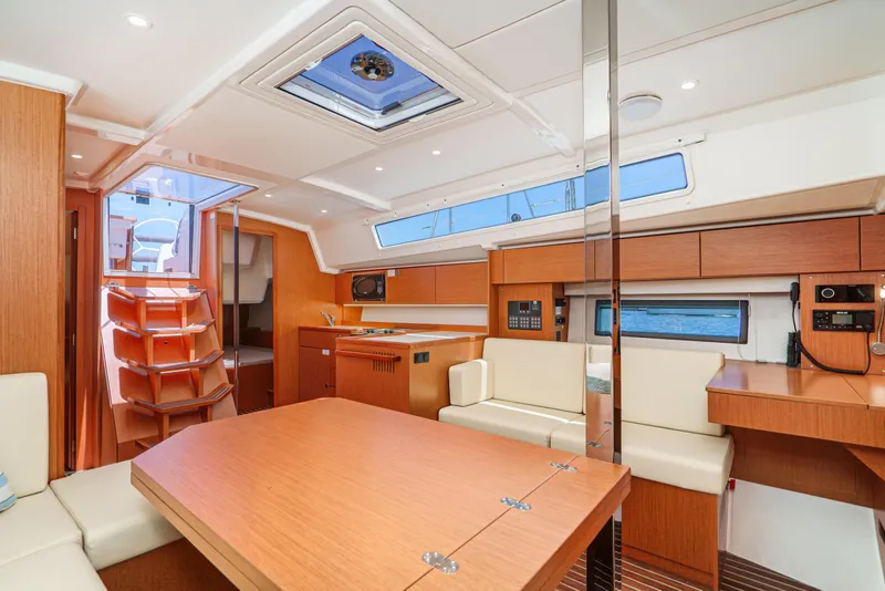 Slide: The Image of Modern interior of 2023 Bavaria C42 yacht with wood finish and comfortable seating. - 38
