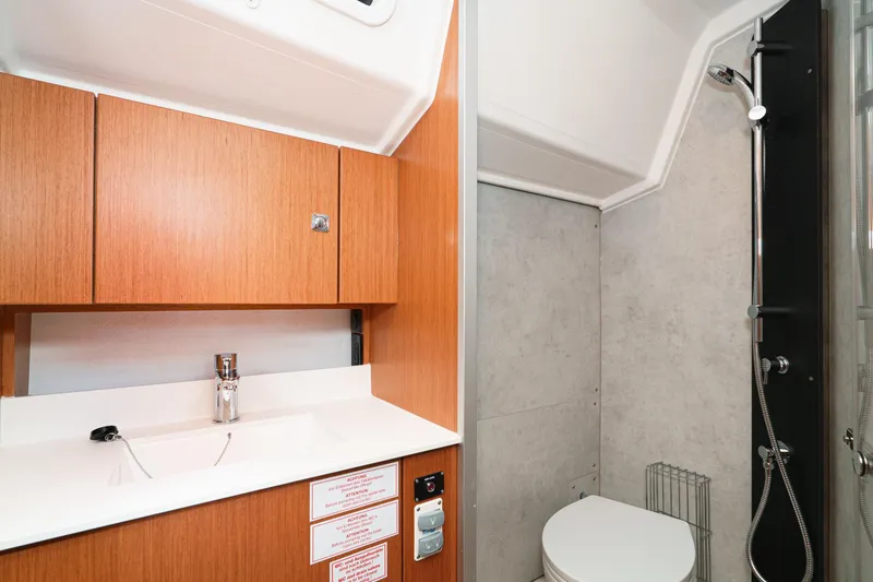 Slide: The Image of Modern bathroom in 2023 Bavaria C42 yacht with wooden cabinets and sleek fixtures. - 51