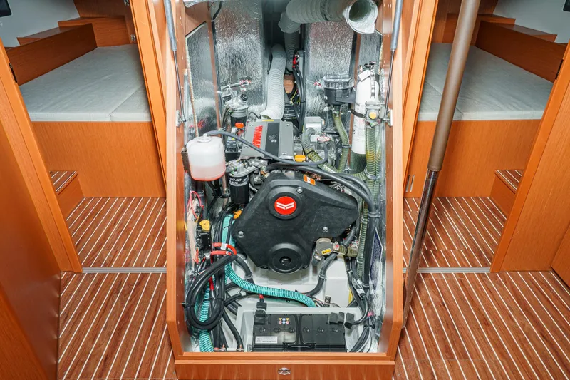 Slide: The Image of Engine room of 2023 Bavaria C42 yacht, showcasing modern equipment and wooden interior design. - 52