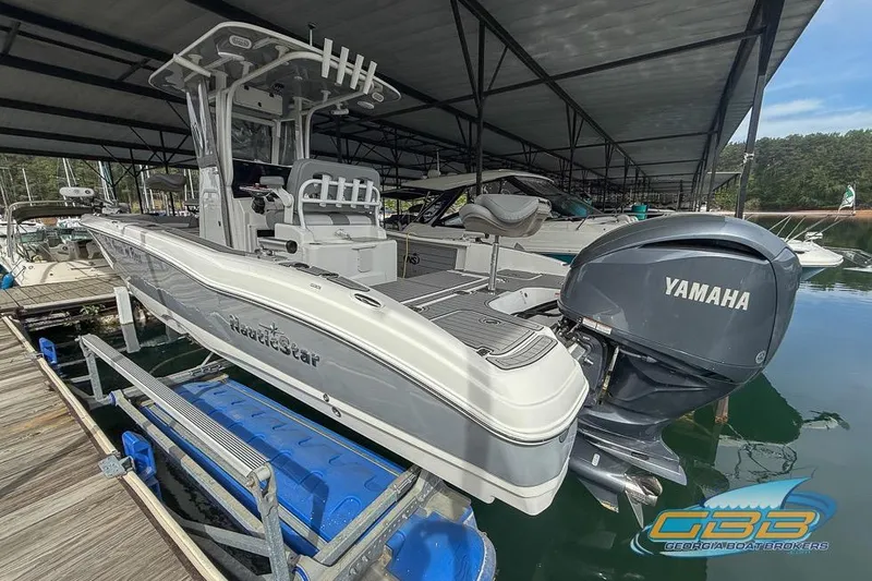 Slide: The Image of 2022 NauticStar 251 Hybrid boat with Yamaha engine docked in marina. - 13