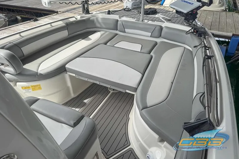 Slide: The Image of 2022 NauticStar 251 Hybrid boat interior with gray seating and deck. - 18