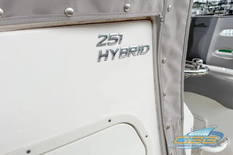 Slide: The Image of 2022 NauticStar 251 Hybrid boat with logo and protective cover. - 21