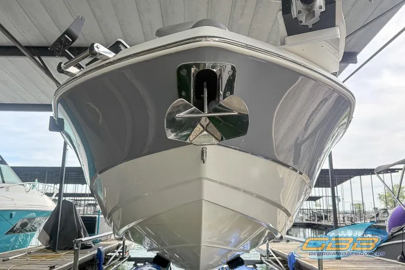 Slide: The Image of 2022 NauticStar 251 Hybrid boat docked, showcasing sleek hull design. - 24