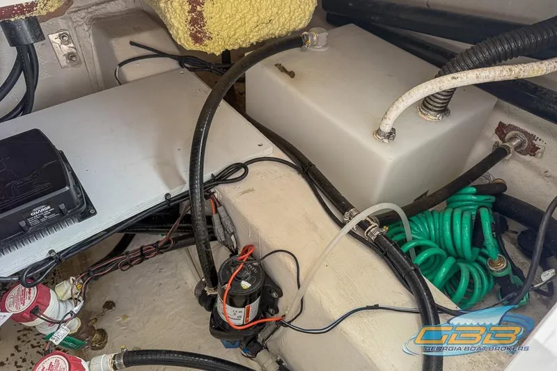 Slide: The Image of Interior view of 2022 NauticStar 251 Hybrid boat showing wiring and components. - 27