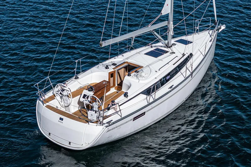 Slide: The Image of 2024 Bavaria Cruiser 34 sailing yacht on open water. - 11