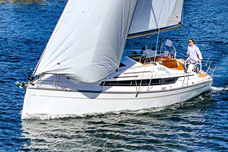 Slide: The Image of 2024 Bavaria Cruiser 34 sailing on open water. - 2