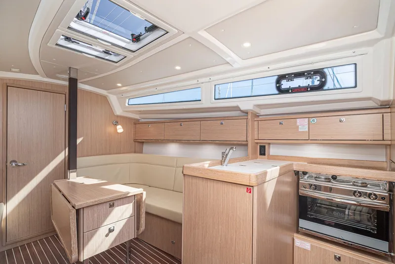 Slide: The Image of Modern interior of 2024 Bavaria Cruiser 34 yacht with kitchen and seating area. - 27