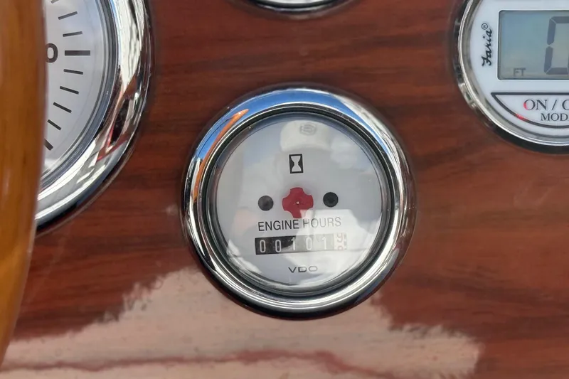 Slide: The Image of Close-up of 1992 Elite Craft Riveria engine hour meter on wooden dashboard. - 13