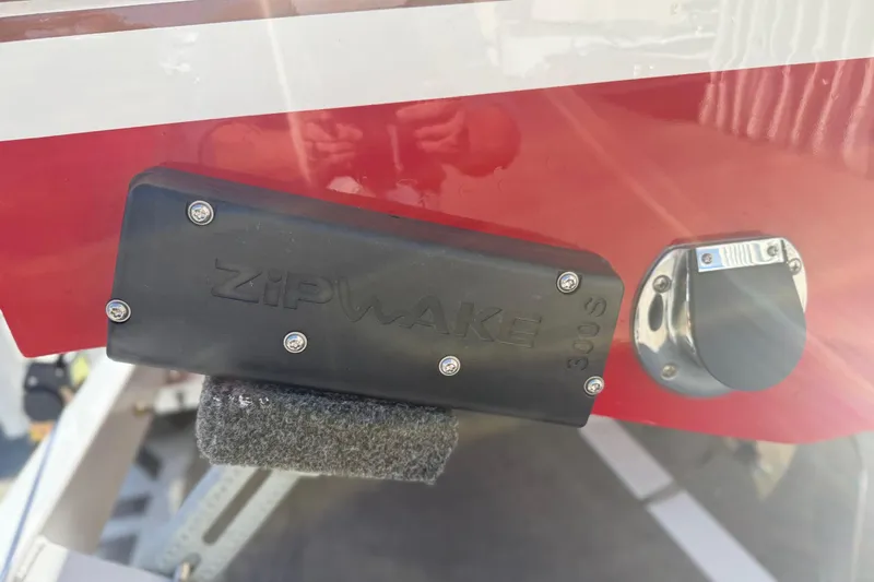 Slide: The Image of Close-up of a 1992 Elite Craft Riveria boat with Zipwake 300S installed. - 17