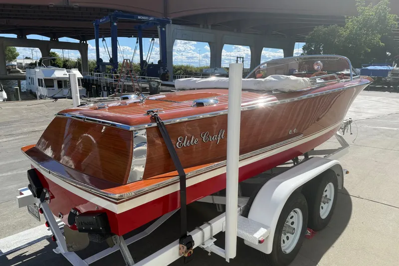 Slide: The Image of 1992 Elite Craft Riveria boat on trailer, showcasing polished wood finish and classic design. - 3