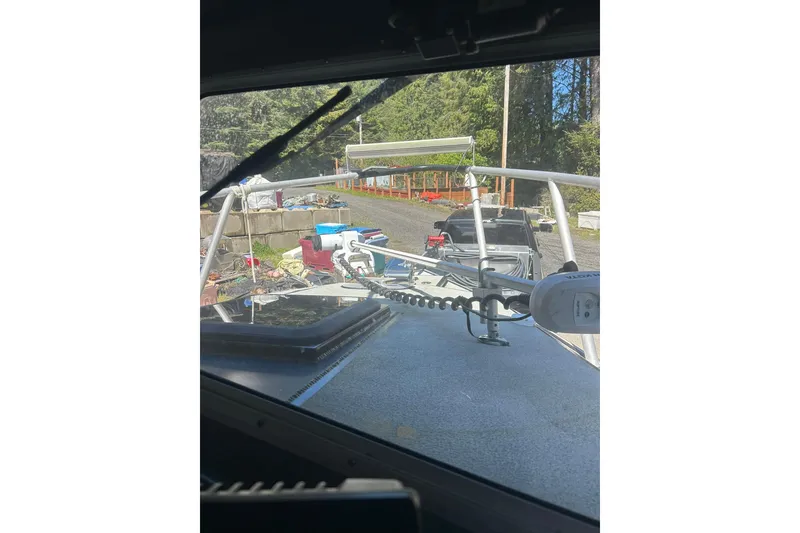 Slide: The Image of 2016 North River 29 Offshore boat on trailer, surrounded by outdoor equipment. - 10