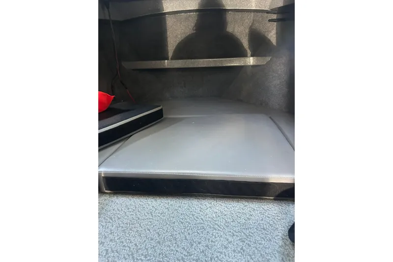 Slide: The Image of Interior cabin of 2016 North River 29 Offshore boat, featuring cushioned seating. - 13