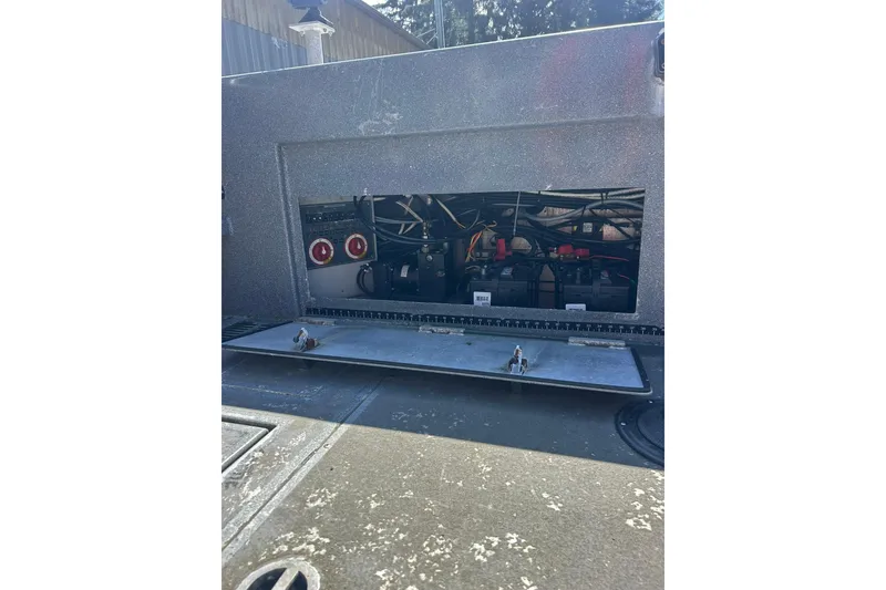 Slide: The Image of 2016 North River 29 Offshore boat compartment with visible wiring and components. - 17