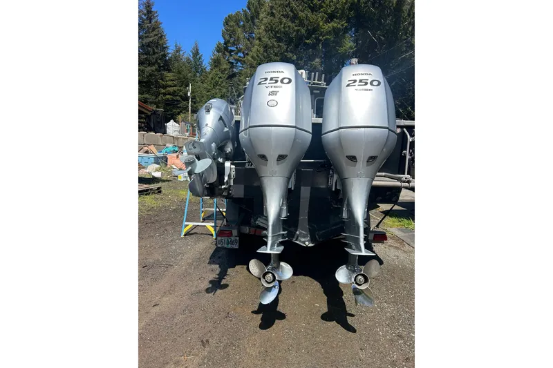 Slide: The Image of Twin Honda 250 outboard motors on a 2016 North River 29 Offshore boat. - 29