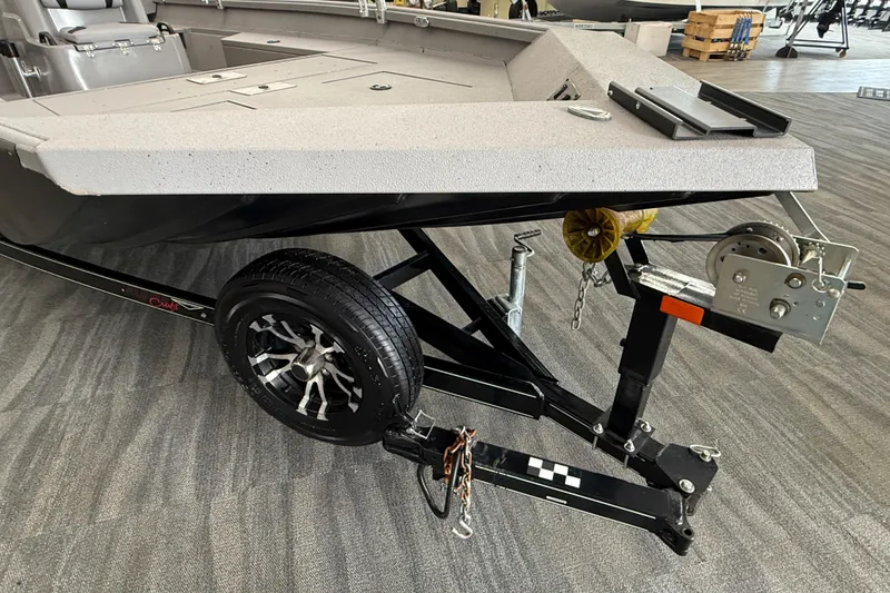 Slide: The Image of 2020 Alumacraft 20 Bay boat on trailer, featuring a sturdy winch and sleek design. - 25