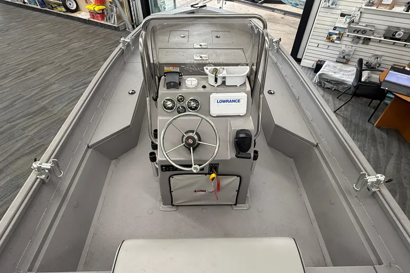 Slide: The Image of 2020 Alumacraft 20 Bay boat interior with steering console and navigation equipment. - 31